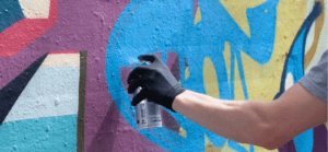 Spray painting street art mural