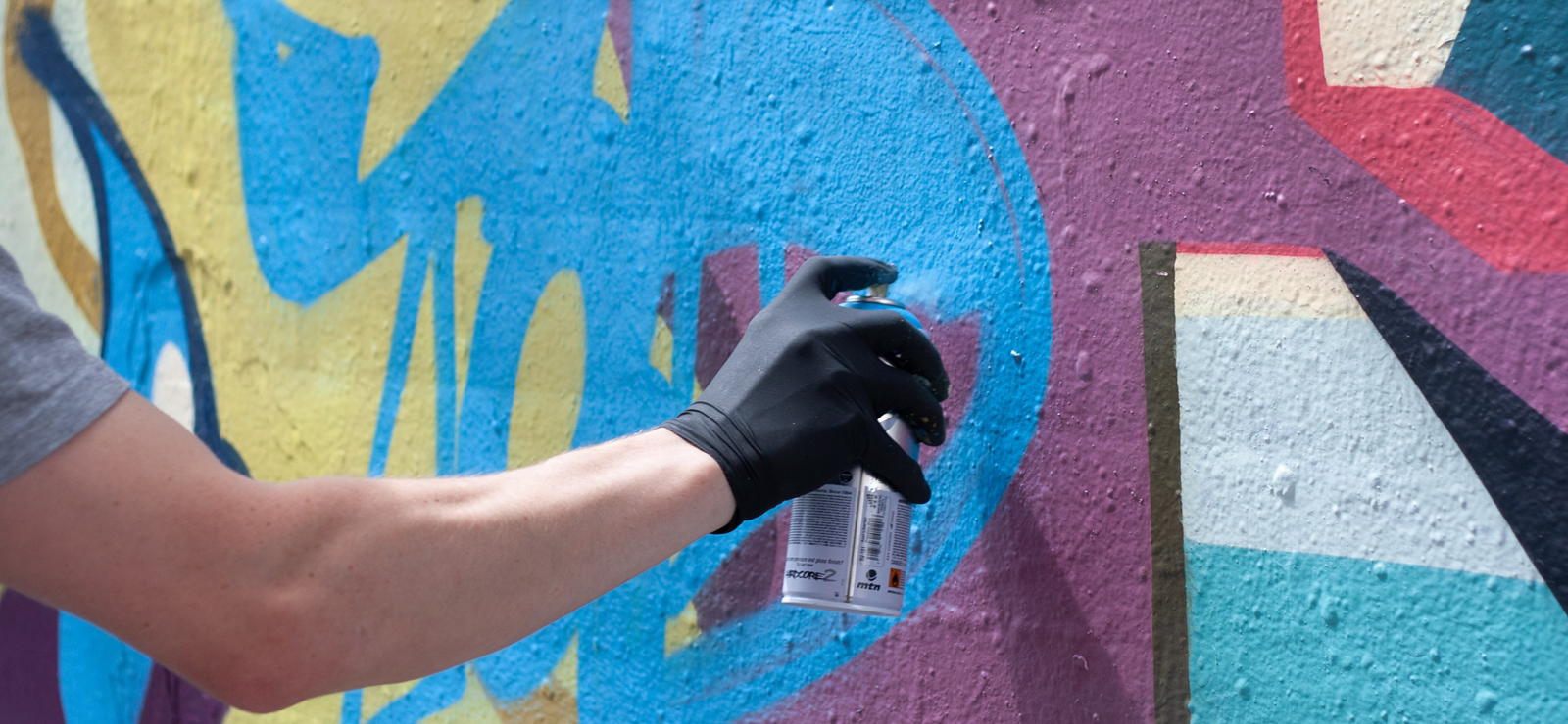 artist holding spray can graffiti